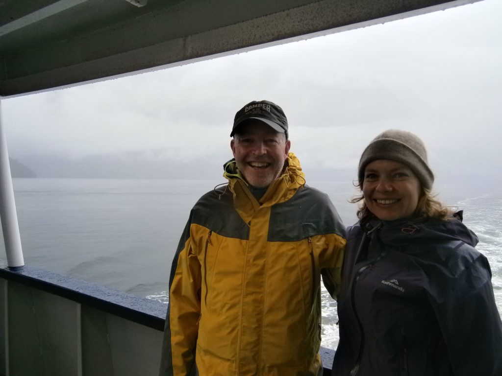 Our lucky raincoats - on the Milford Sound.