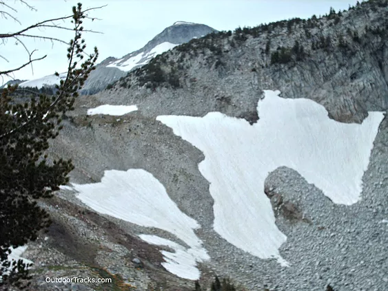 snow patches on rocky slope; Glacier Mt. peak