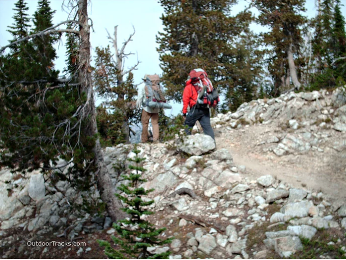 hikers on rocky mountain trail