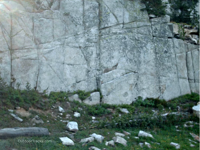 Granite cliff closeup showing cracks